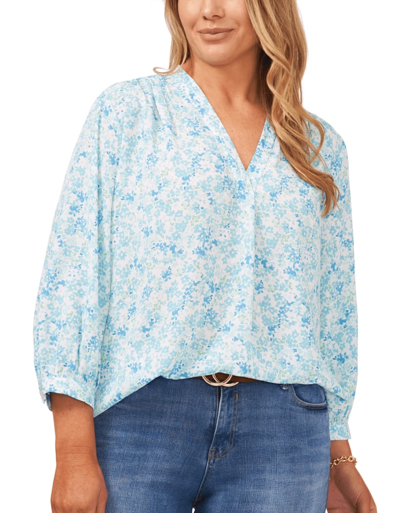 Front of a model wearing a size 1X Floral Field V-Neck Blouse in COOL WATERS by Vince Camuto. | dia_product_style_image_id:261359